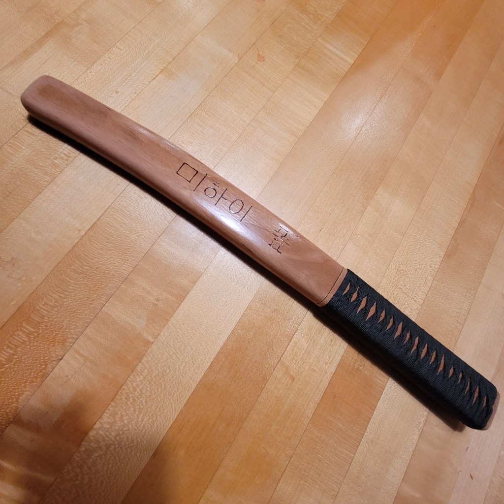 Tanto-like knife in it's scabbard